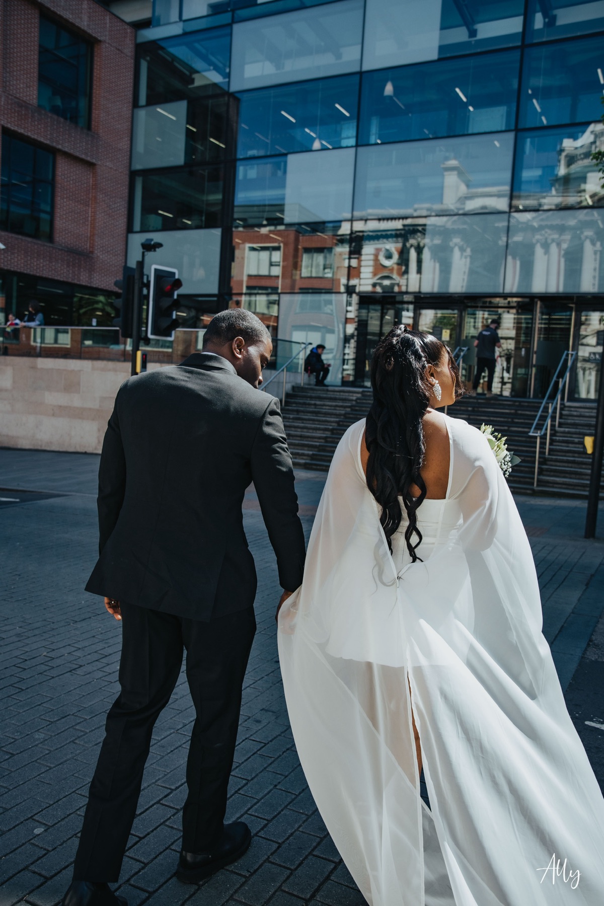 Mercy and Ifeoluwa walking together on their wedding day