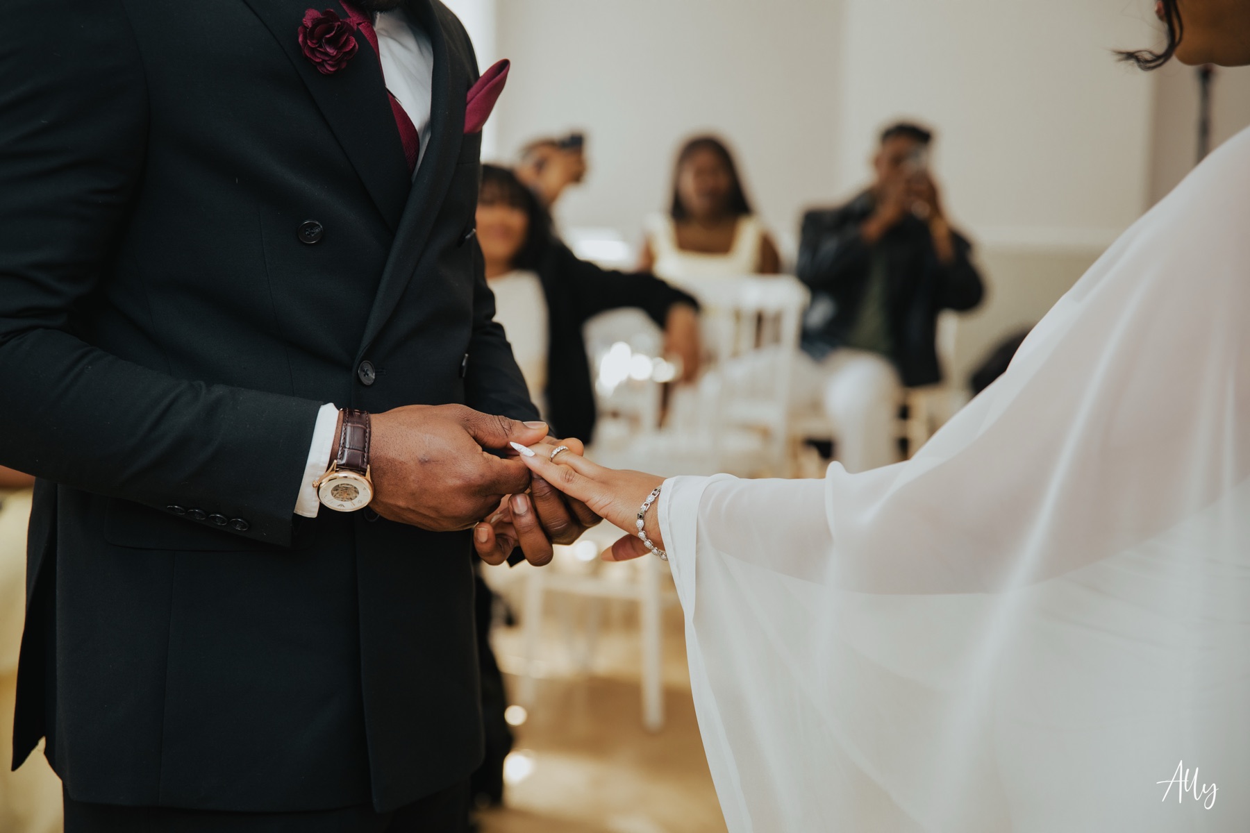 Mercy and Ifeoluwa holding hands during their ceremony